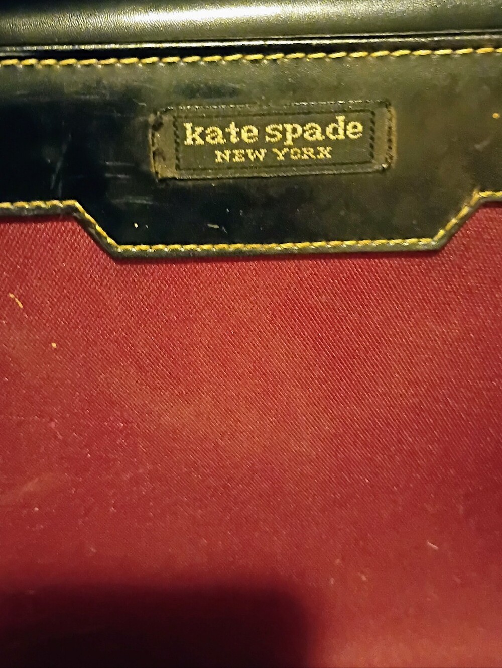 kate spade burgundy shoulder bag with black trim